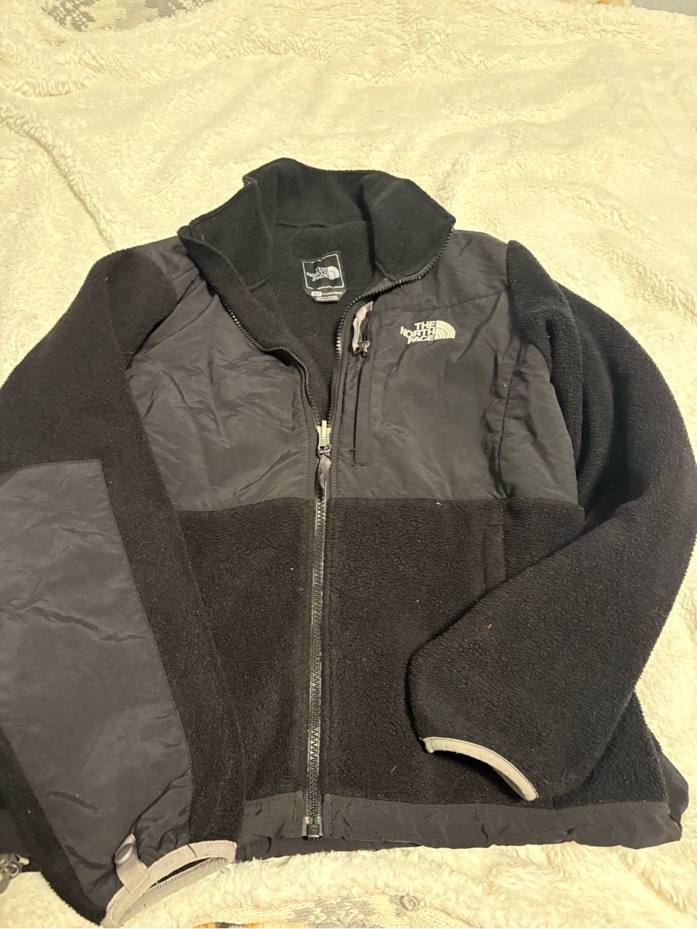 The North Face women’s Black Fleece Jacket with Zip Chest Pocket